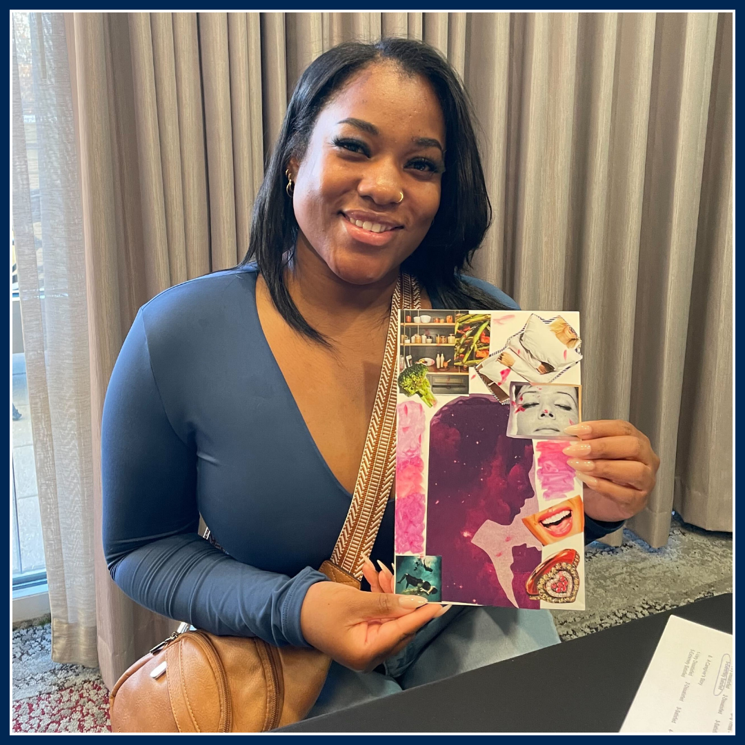 A caregiver holding a piece of artwork they created, smiling proudly. The collaged artwork appears colorful and detailed, showcasing their creativity and talent.