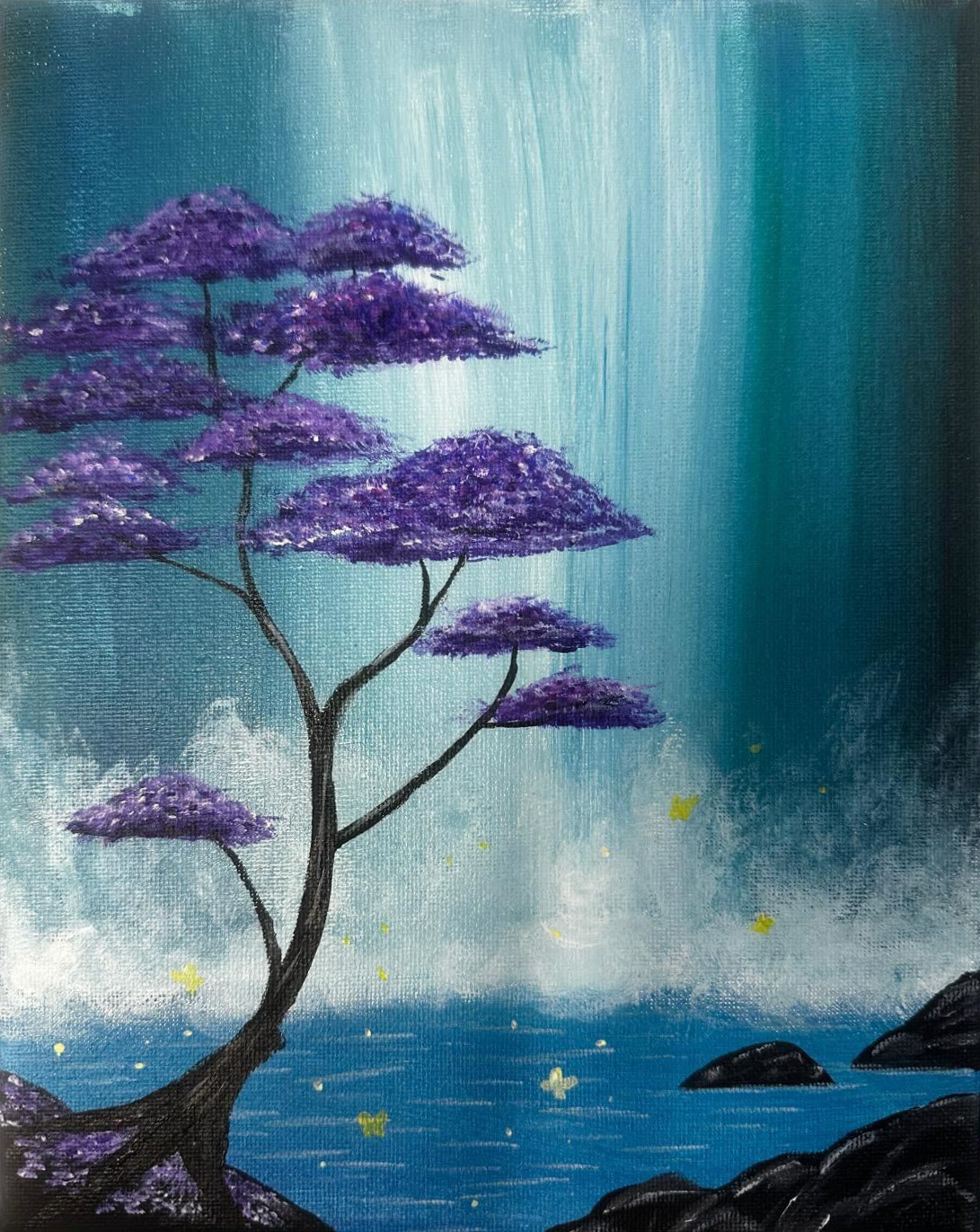 Painting by Natasha Lewis depicting a tree with dark branches and vibrant purple foliage beside a reflective body of water. A cascading blue and white waterfall fills the background, creating a soft, misty atmosphere. Small yellow light elements appear near the water’s surface, and dark rocks frame the lower edge of the scene.